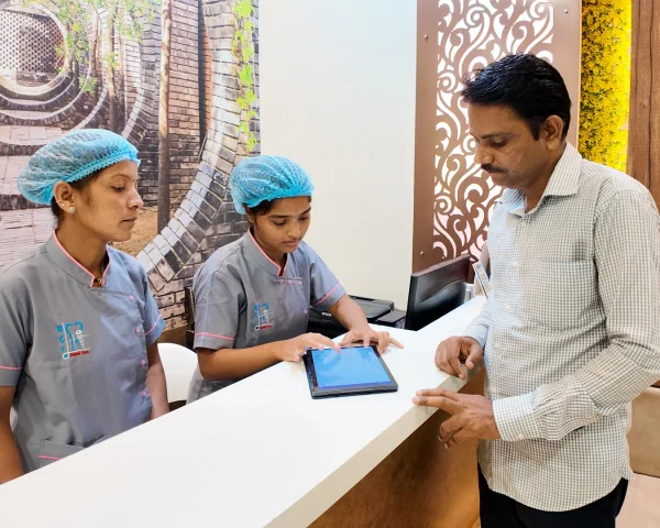 Patient welcome and entry in system at Dr Pingale Dental Clinic in Chikhli